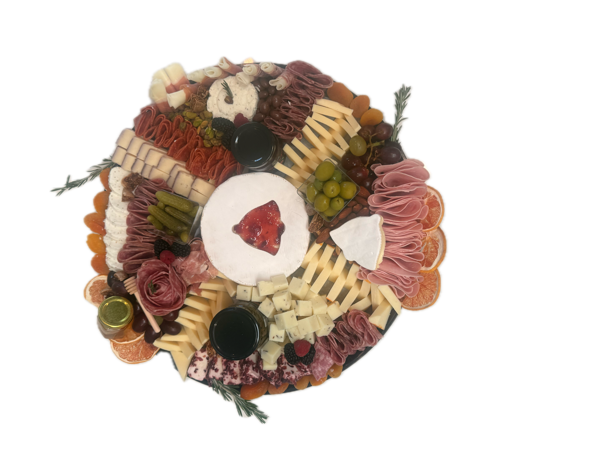 Holiday charcuterie board with cured meats, cheeses, olives and fruit from Newport Beach catering service