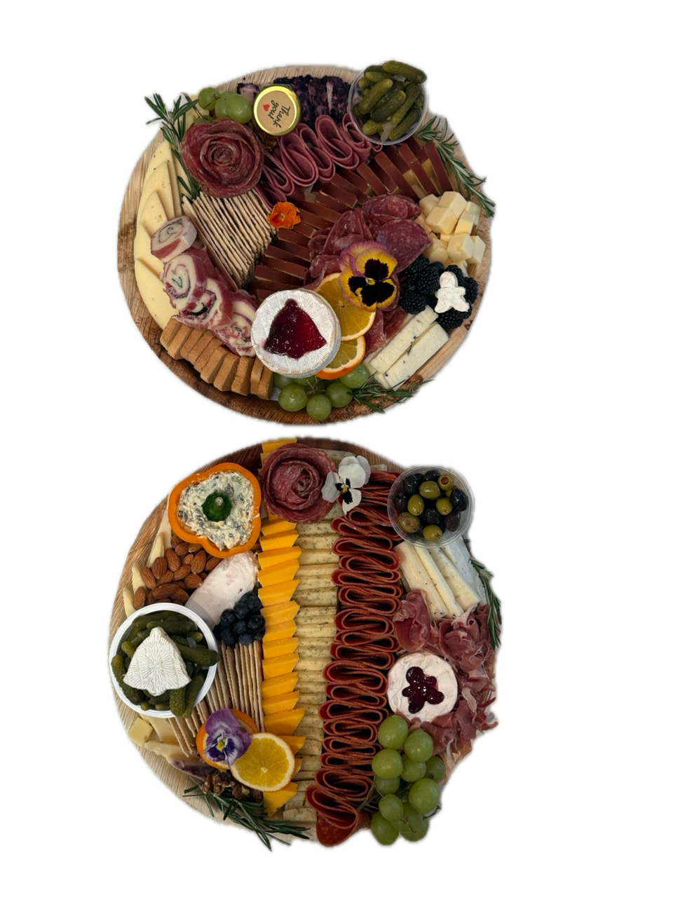 Two large round charcuterie boards stacked vertically on white background for Orange County catering